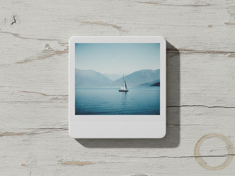 Family photos displayed as custom magnets on a fridge